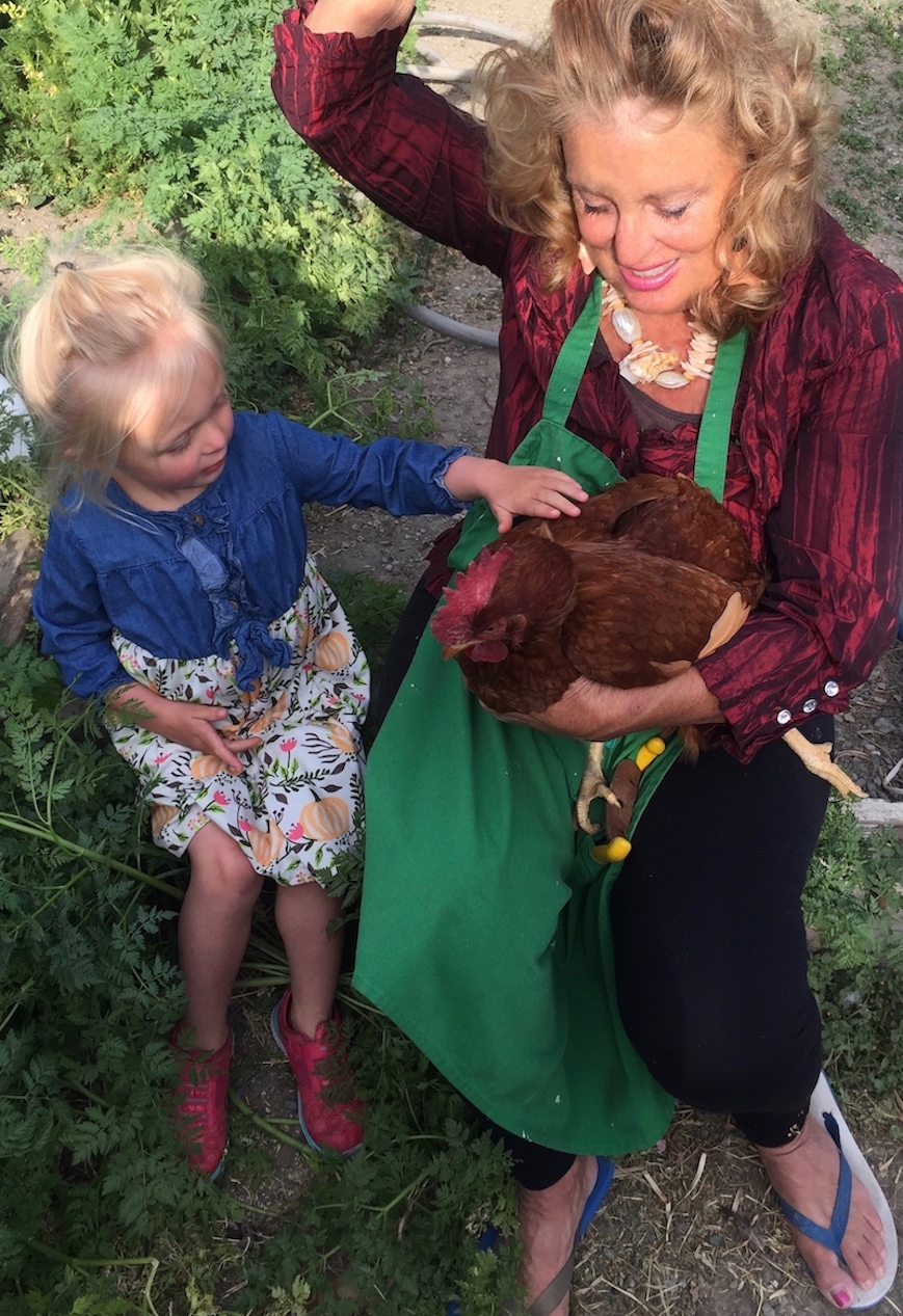 Cynthia teaching poultry to child.jpg